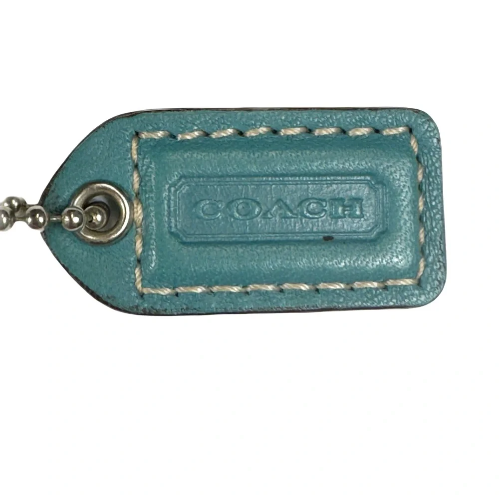 Coach turquoise leather wristlet w orig Coach hangtag, trigger snap closure